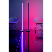 Tono LED floor lamp lighting a room in pink