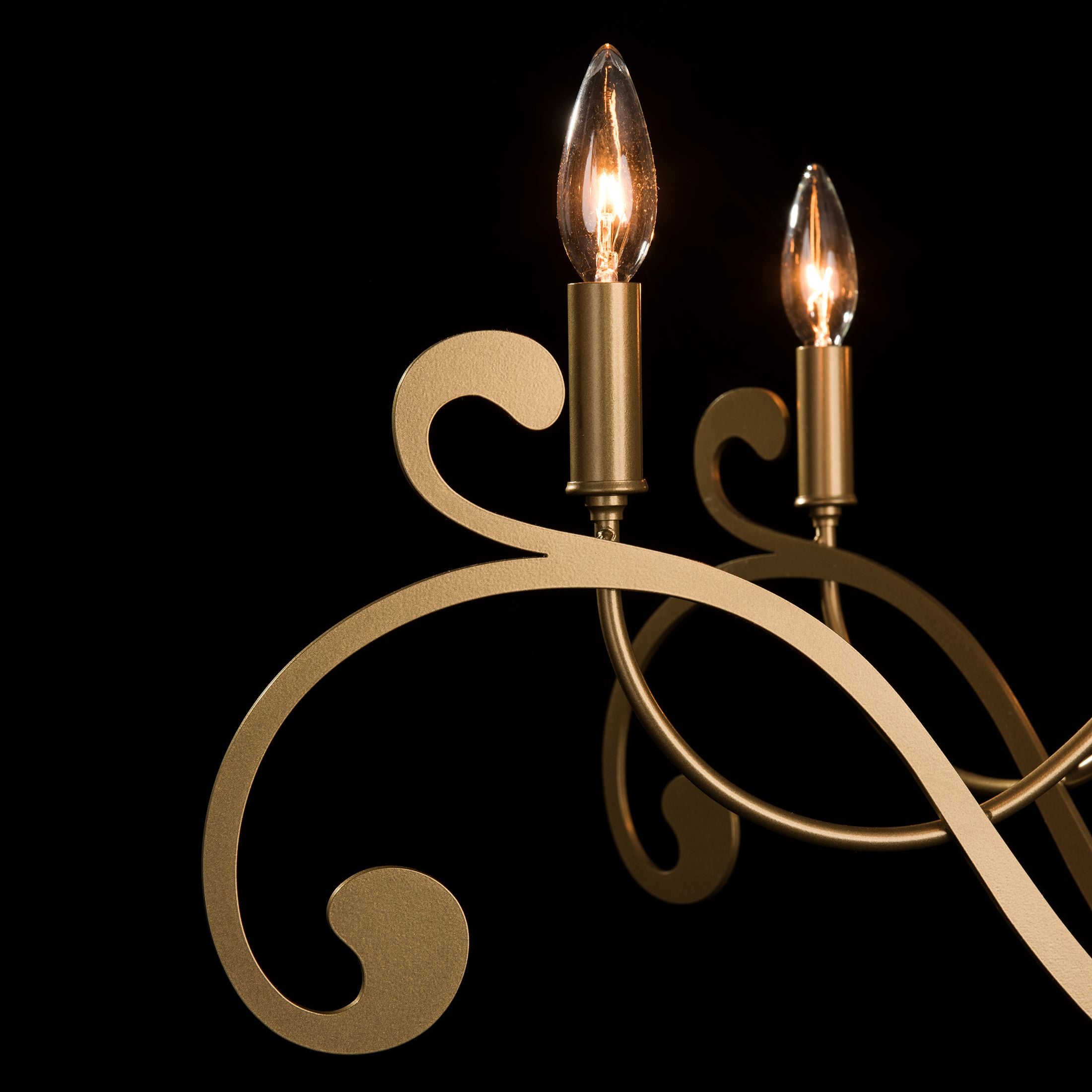 Scroll and lamping details of Bella 6 arm chandelier from Synchronicity