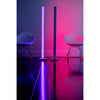 Tono LED floor lamp lighting a room in pink