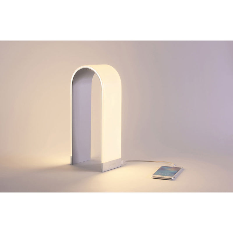 Mr. N tall by Koncept lighting charging a mobile phone