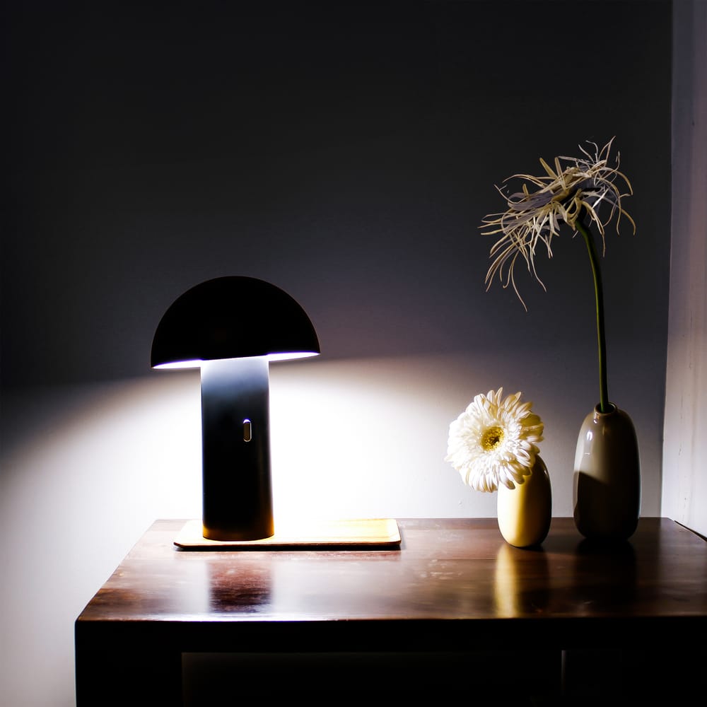 Shitake: Your go-to table lamp with adaptable lampshade, simple touch button control, and up to 20 hours of uninterrupted illumination.