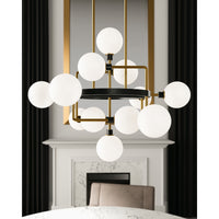 detail view of viaggio chandelier from tech lighting with opal glass globes in brass finish