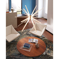 Photon LED large pendant hanging over a round wooden coffee table