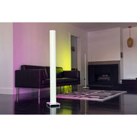 Tono LED floor lamps lighting a living room in pink and yellow light