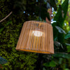 Illuminate your outdoor space with Okinawa Hang, a handmade bamboo pendant lamp with a convenient wireless, rechargeable bulb.