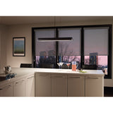 zhane linear pendant in black rubberized finish hanging over a kitchen island