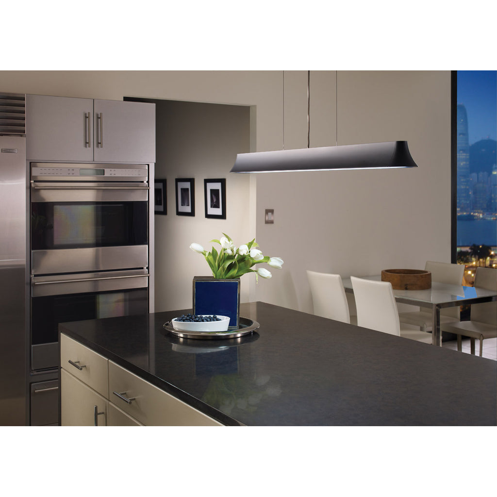 zhane linear pendant in satin nickel hanging over black granite kitchen island